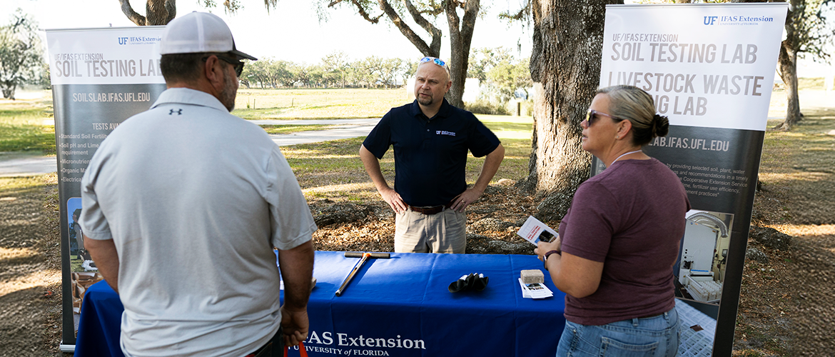 Dr. Franta Majs tabling at the 2025 Range Cattle Research and Education Center Field Day about the U.F. Extension Soil Testing Laboratory.
